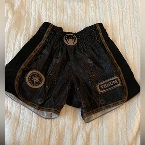 Venum Muay Thai shorts. Men’s size medium. Black and Gold.